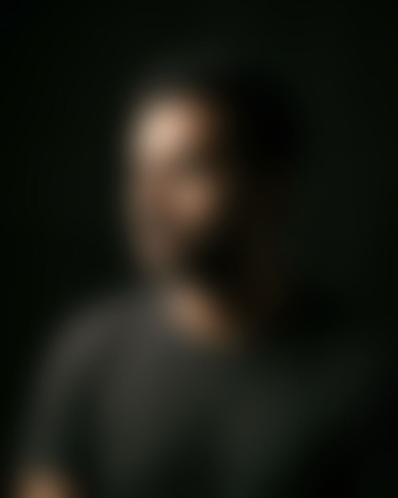 Blurred portrait of a fictional persona: The Founder.