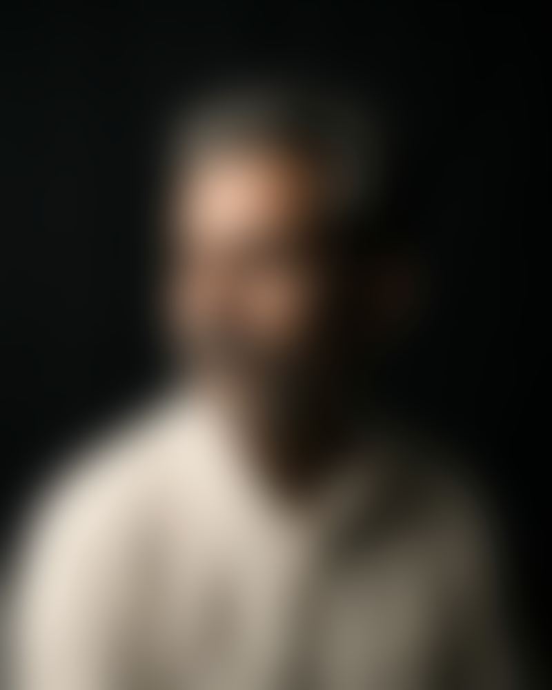 Blurred portrait of a fictional persona: The Shopkeeper.